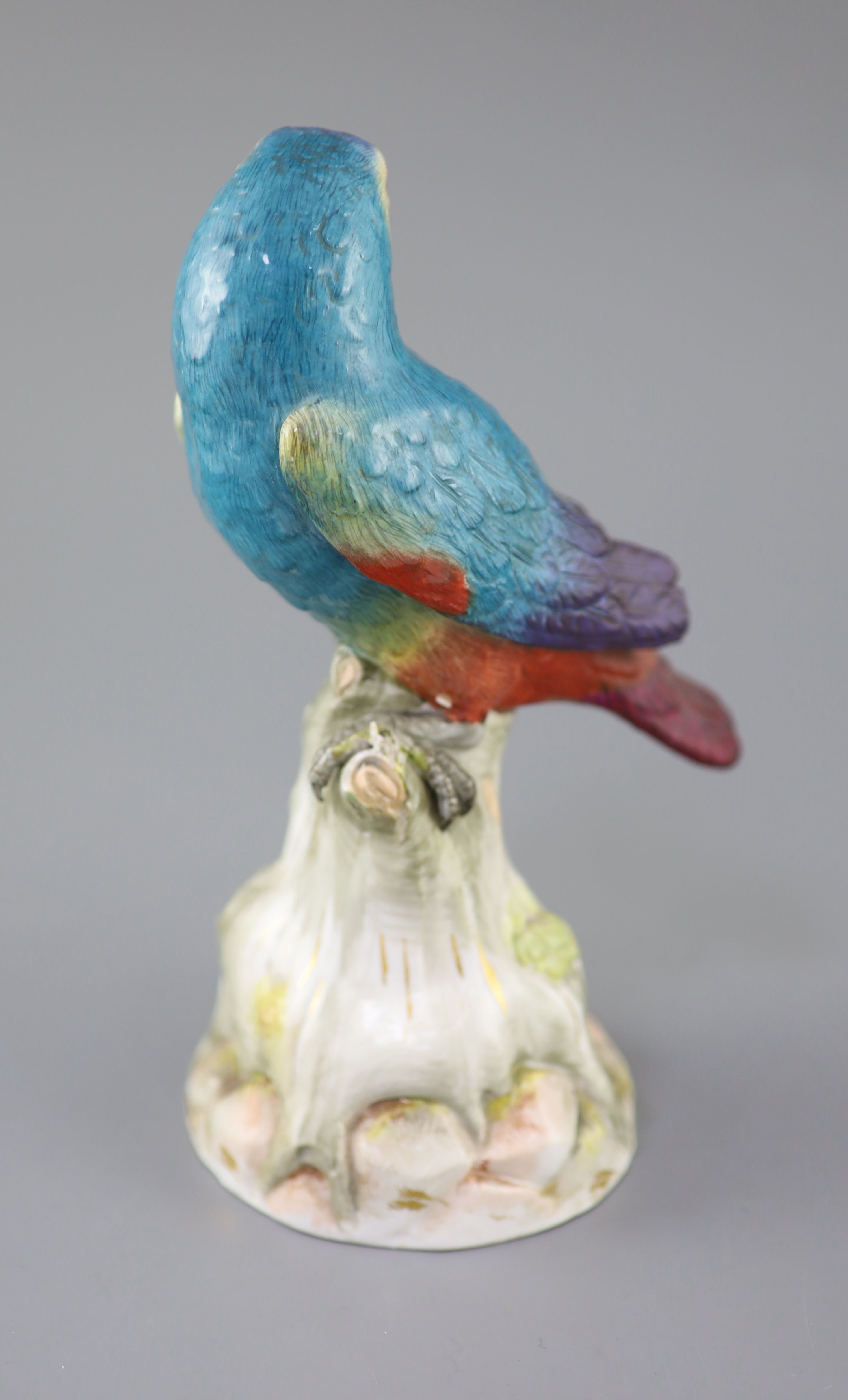 A Meissen model of a parrot seated on a tree stump, late 19th century, 22cm high